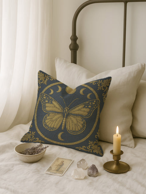 a bedroom scene with a bed, a pillow with a butterfly design, a candle, a tarot card, and crystals on the bed.